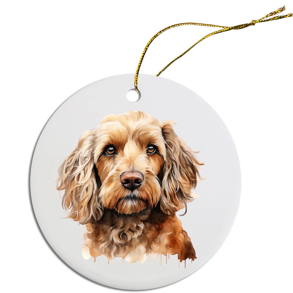 Ceramic round Christmas ornament featuring a Cockapoo design with a golden string for hanging.