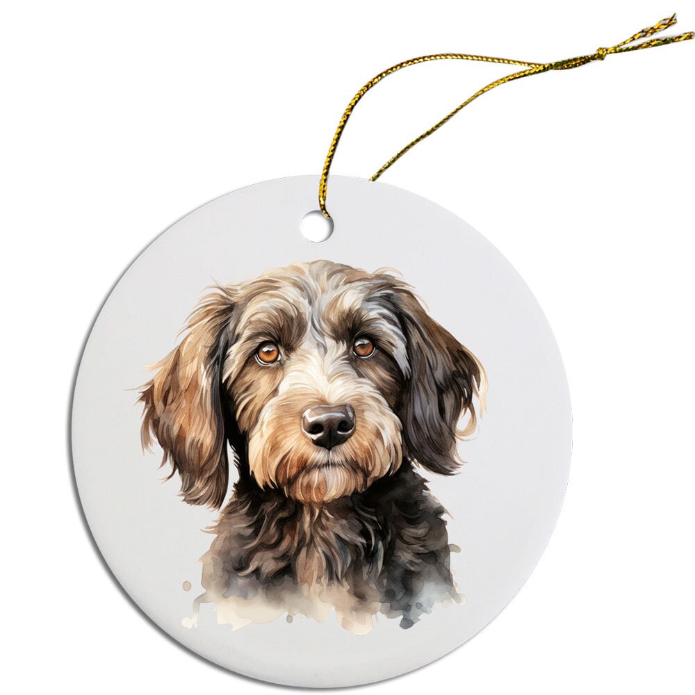 Ceramic round Christmas ornament featuring a Cockapoo design with a golden string for hanging.