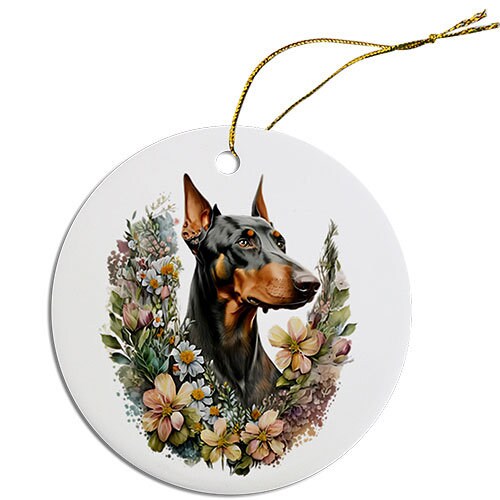 Ceramic round Christmas ornament featuring a Doberman design with a golden string for hanging.