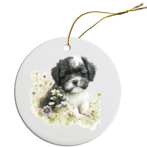 Ceramic round Christmas ornament featuring a Havanese dog design with a golden string for hanging.