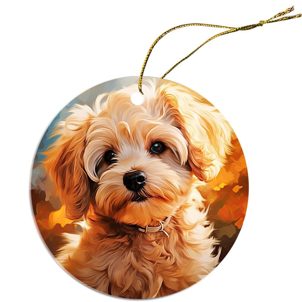 Ceramic round Christmas ornament featuring a Maltipoo design, with a golden string for hanging.