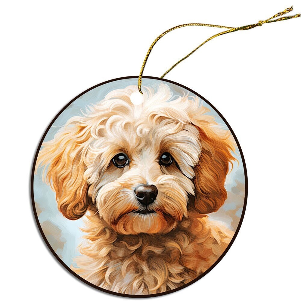 Ceramic round Christmas ornament featuring a Poochon design with a golden string, perfect for holiday decor.