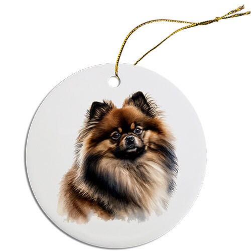 A round ceramic Christmas ornament featuring a cute Pomeranian design, with a golden string for hanging.