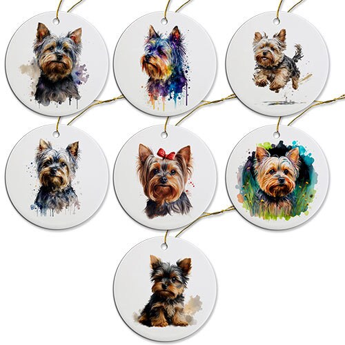 A round ceramic Christmas ornament featuring a cute Yorkie design, with a golden string for hanging.