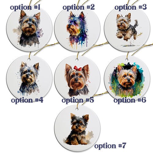 A round ceramic Christmas ornament featuring a cute Yorkie design, with a golden string for hanging.