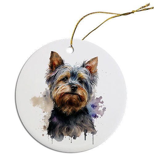 A round ceramic Christmas ornament featuring a cute Yorkie design, with a golden string for hanging.