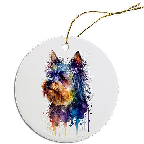 A round ceramic Christmas ornament featuring a cute Yorkie design, with a golden string for hanging.