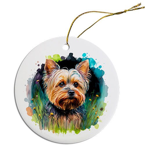 A round ceramic Christmas ornament featuring a cute Yorkie design, with a golden string for hanging.