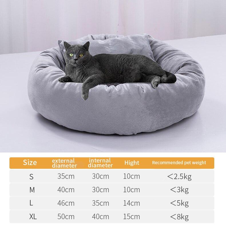 Cute round pet bed for dogs and cats, featuring a soft pillow and warm fabric, perfect for winter use.