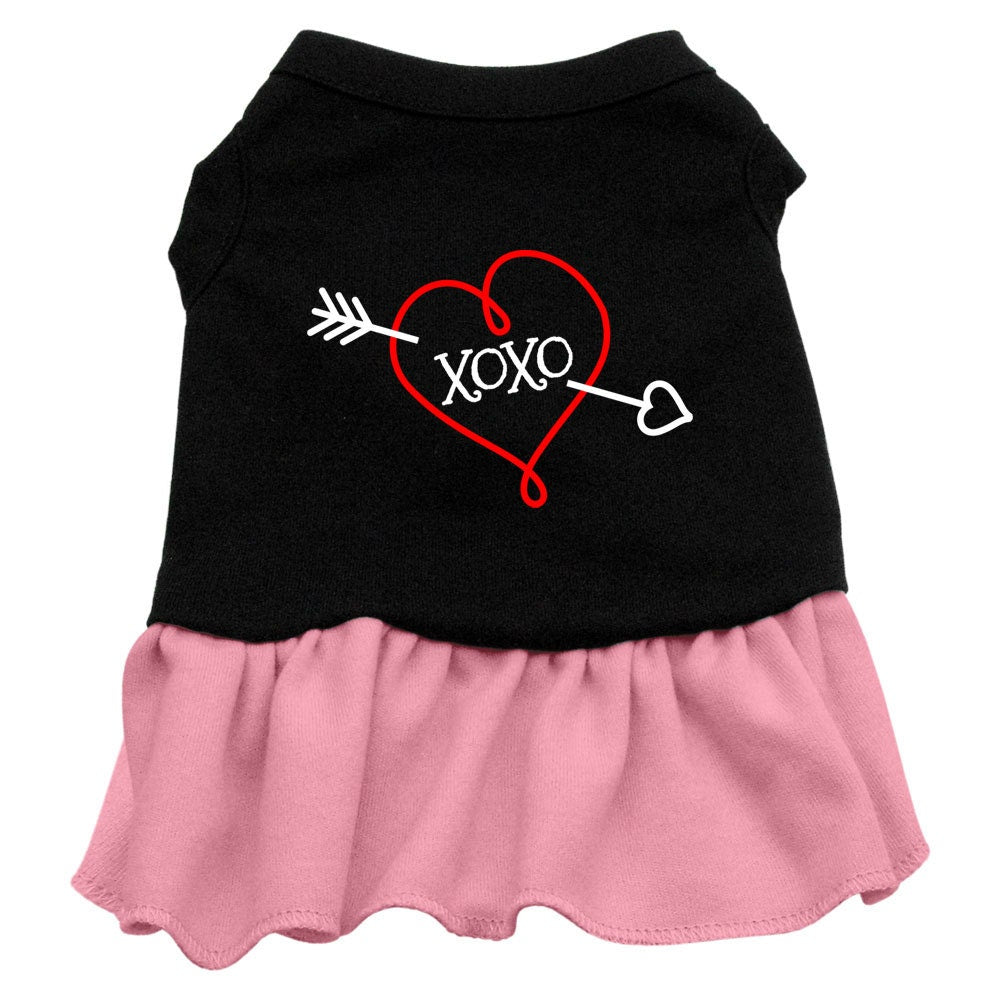 A cute dog wearing a soft, screen printed dress with 'XOXO' design, showcasing comfort and style.