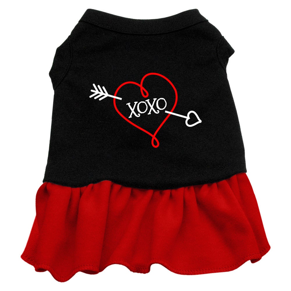 A cute dog wearing a soft, screen printed dress with 'XOXO' design, showcasing comfort and style.