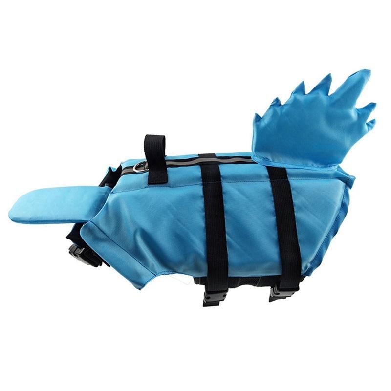 A vibrant shark-themed dog life vest designed for swimming, featuring adjustable straps and a sturdy handle for safety.