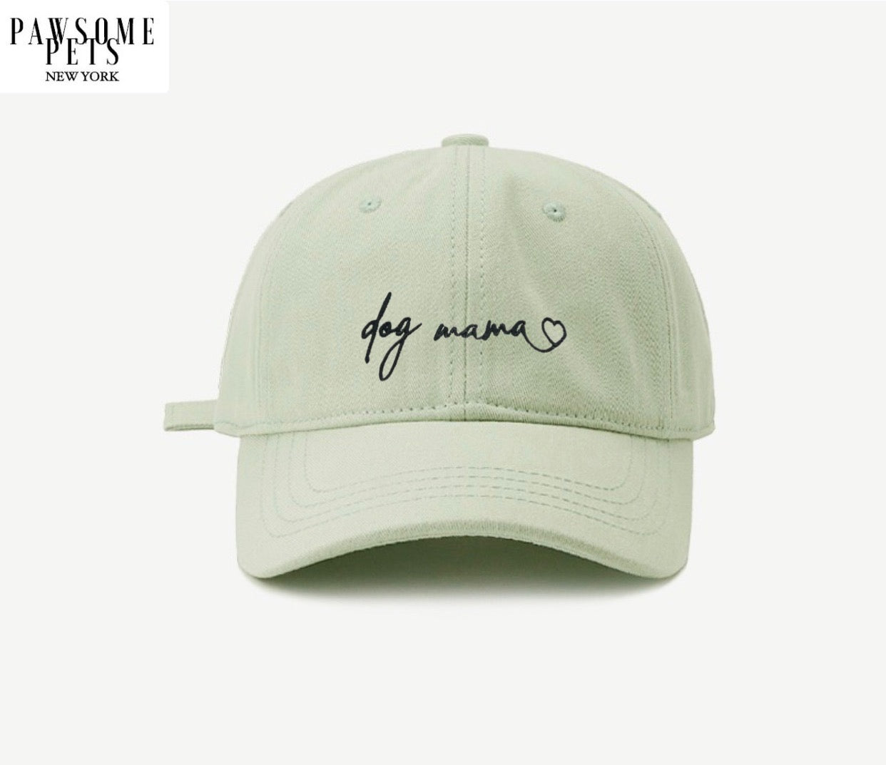 Light bean green baseball cap with embroidered DOG MOM lettering, adjustable metal buckle, and pre-curved visor.