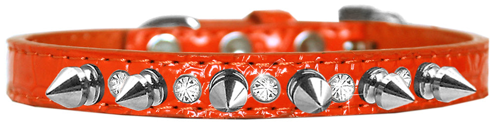 A stylish dog collar featuring silver spikes and clear jewels on a faux leather base, showcasing elegance and sophistication for pets.