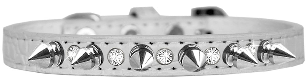 A stylish dog collar featuring silver spikes and clear jewels on a faux leather base, showcasing elegance and sophistication for pets.