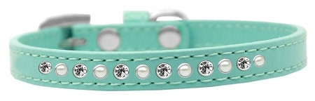 Stylish dog collar featuring pearls and clear crystals on faux leather, perfect for pets.