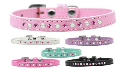 A stylish dog collar featuring pearl and pink crystals on a faux leather base, showcasing a crystal buckle.