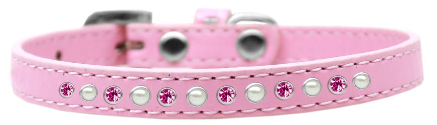 A stylish dog collar featuring pearl and pink crystals on a faux leather base, showcasing a crystal buckle.