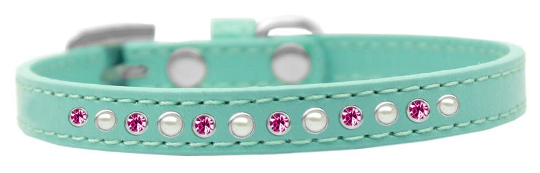 A stylish dog collar featuring pearl and pink crystals on a faux leather base, showcasing a crystal buckle.