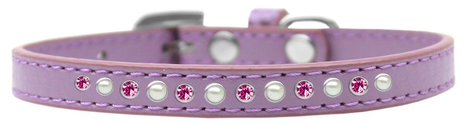 A stylish dog collar featuring pearl and pink crystals on a faux leather base, showcasing a crystal buckle.