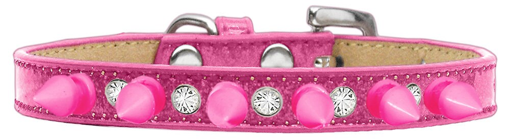 A stylish dog collar featuring clear crystals and bright pink spikes, designed for pets who love to stand out.