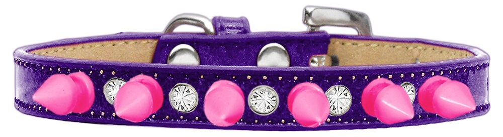 A stylish dog collar featuring clear crystals and bright pink spikes, designed for pets who love to stand out.