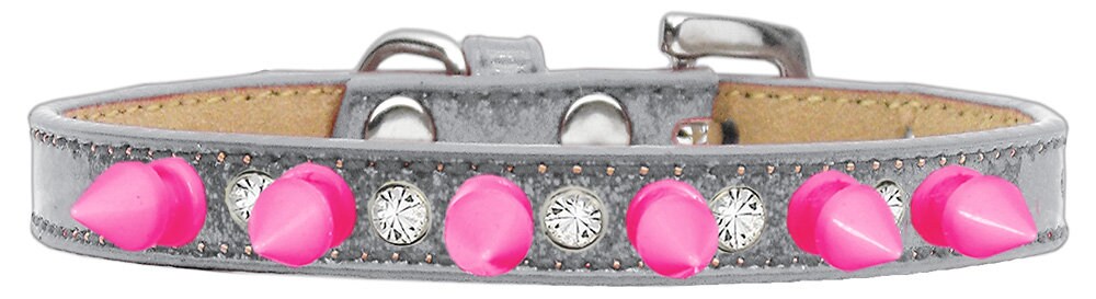 A stylish dog collar featuring clear crystals and bright pink spikes, designed for pets who love to stand out.