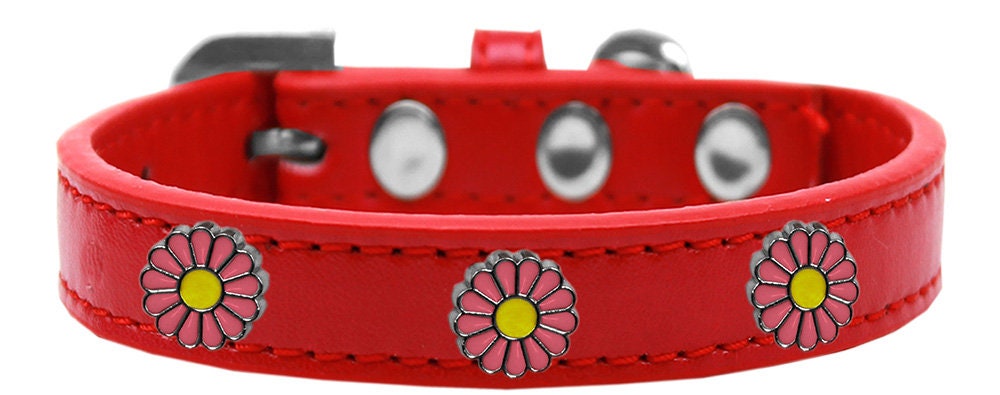 A stylish pink collar for dogs featuring daisies and metal widgets, showcasing a fashionable design.