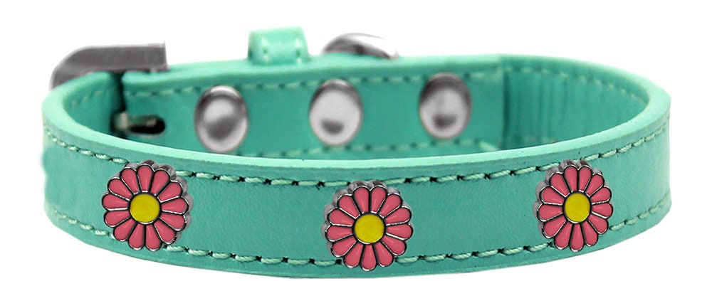A stylish pink collar for dogs featuring daisies and metal widgets, showcasing a fashionable design.