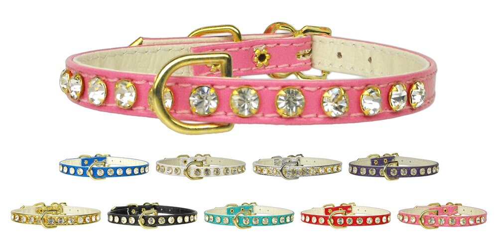Elegant dog collar adorned with clear crystals, featuring a durable design and center D-Ring for leash attachment.
