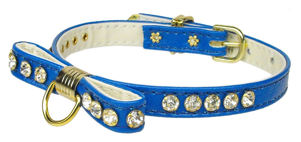 A stylish dog collar featuring a jeweled bow and clear crystals, perfect for pets.