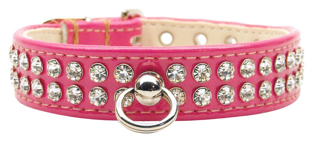 Stylish dog collar with sparkling clear crystals on patent faux leather, featuring a center post for ID tag.