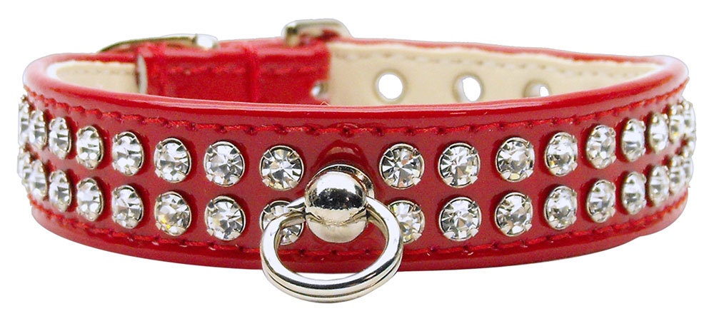 Stylish dog collar with sparkling clear crystals on patent faux leather, featuring a center post for ID tag.