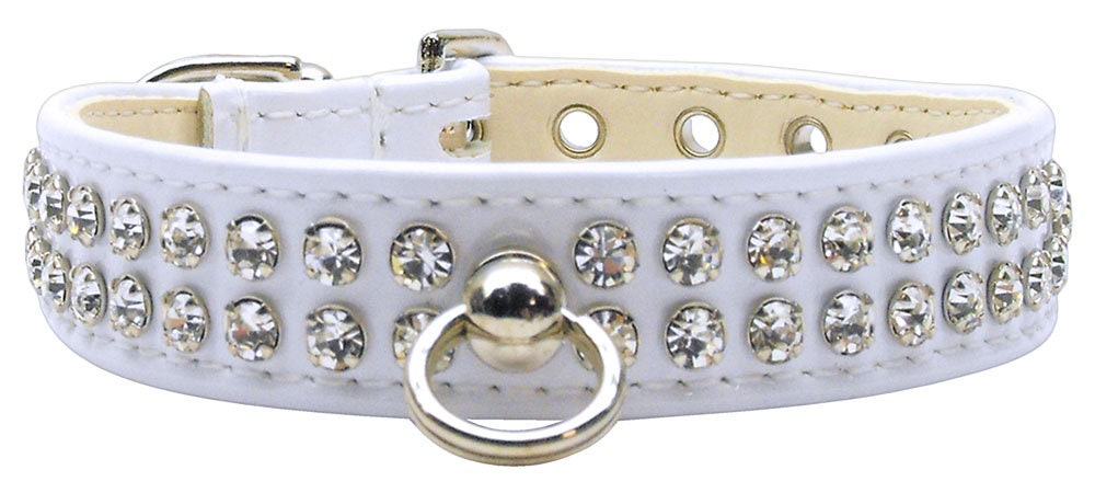 Stylish dog collar with sparkling clear crystals on patent faux leather, featuring a center post for ID tag.