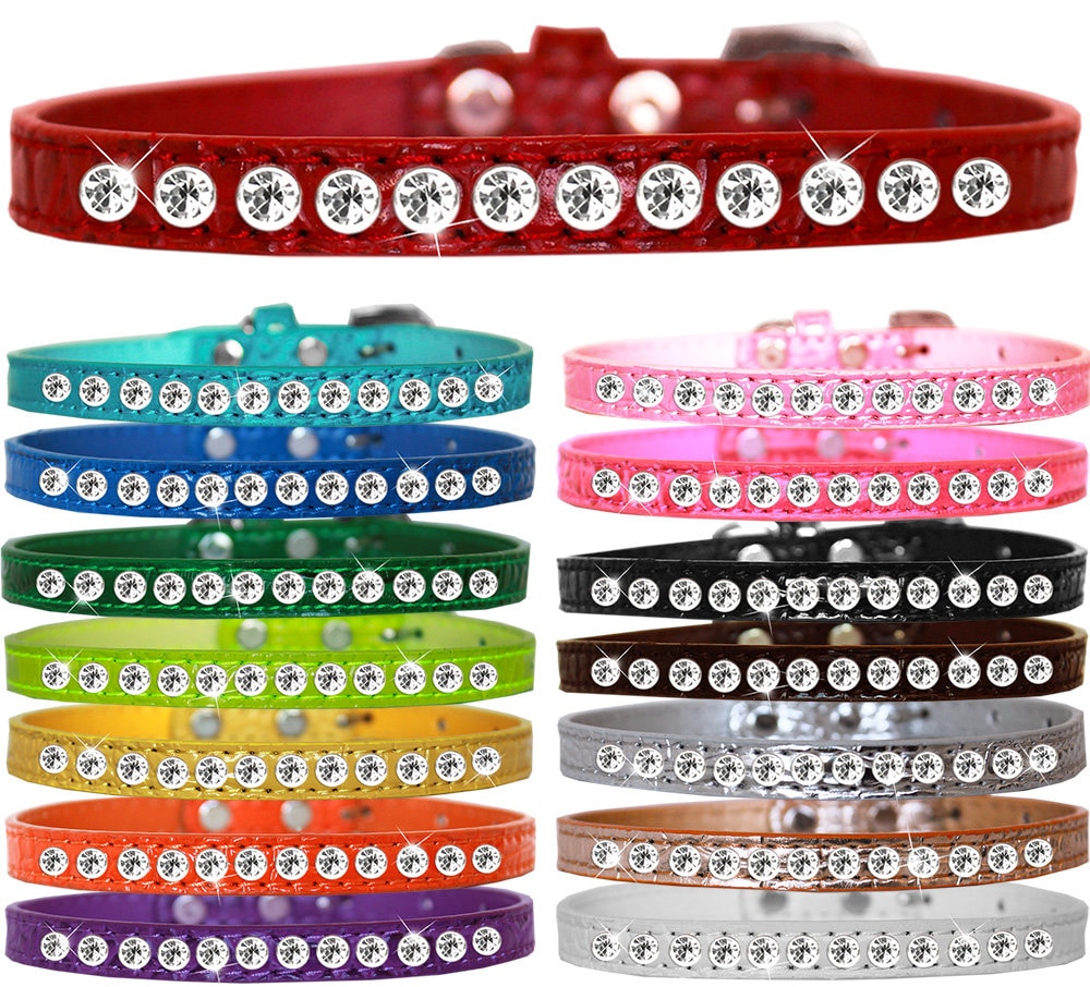 A stylish faux leather dog collar adorned with a row of clear crystals, perfect for small pets.