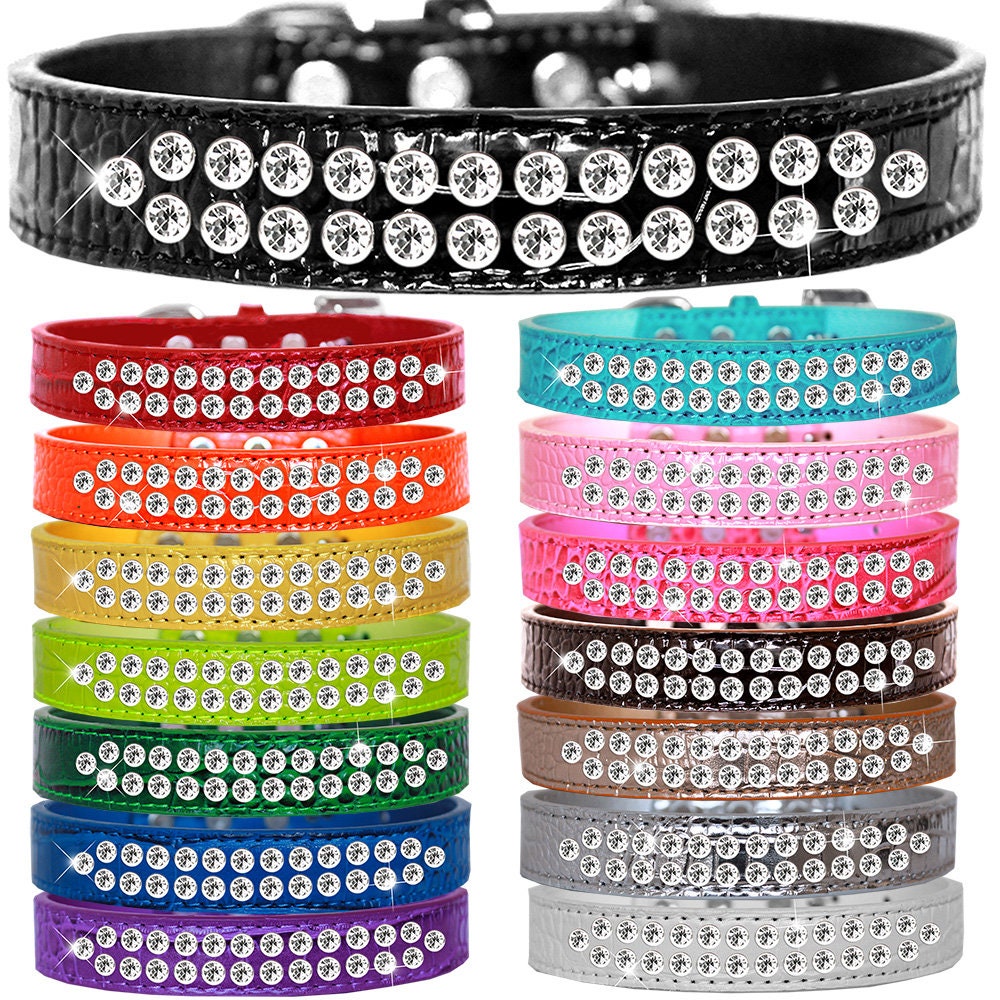 A stylish dog collar made of faux leather featuring two rows of clear crystal stones, designed for pets to add elegance to their look.
