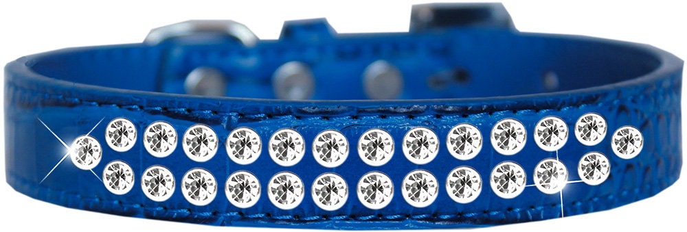 A stylish dog collar made of faux leather featuring two rows of clear crystal stones, designed for pets to add elegance to their look.