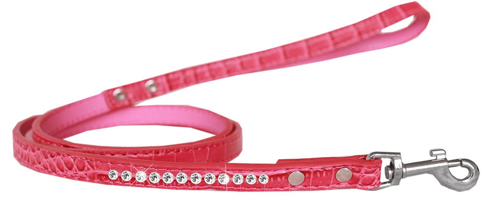 A stylish dog leash made of faux croc material with a row of clear crystals, perfect for pets.