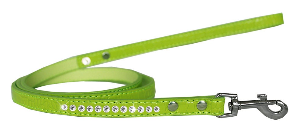 A stylish dog leash made of faux croc material with a row of clear crystals, perfect for pets.