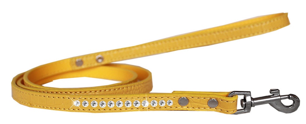 A stylish dog leash made of faux croc material with a row of clear crystals, perfect for pets.