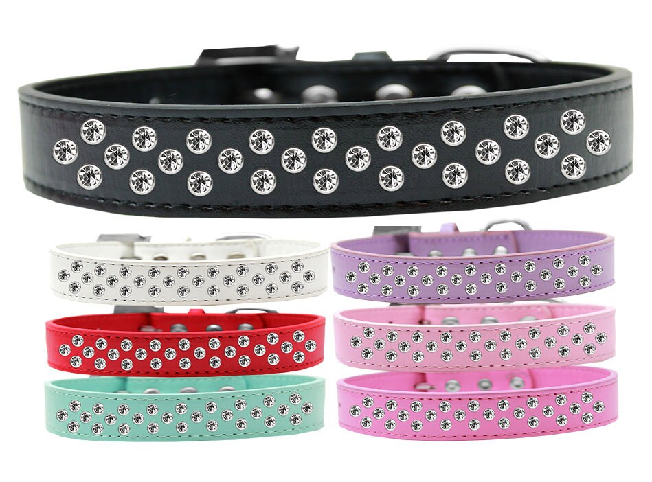 A stylish faux leather dog collar adorned with clear crystal sprinkles, showcasing three rows of sparkling stones.