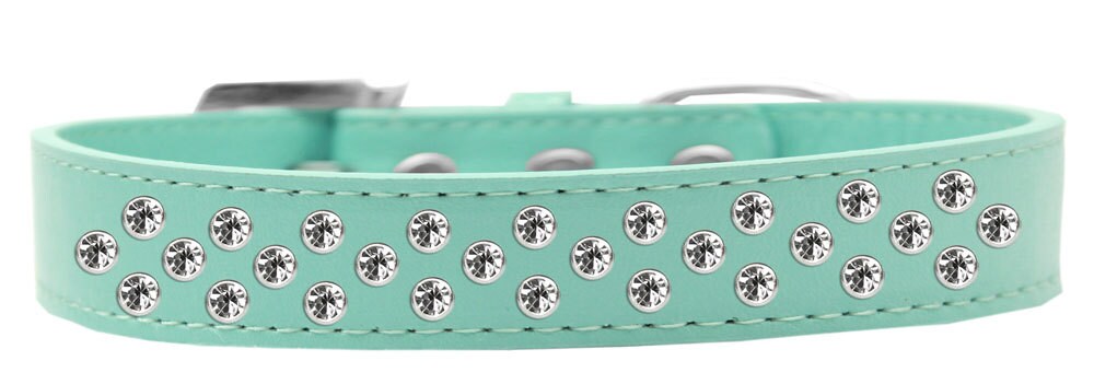 A stylish faux leather dog collar adorned with clear crystal sprinkles, showcasing three rows of sparkling stones.