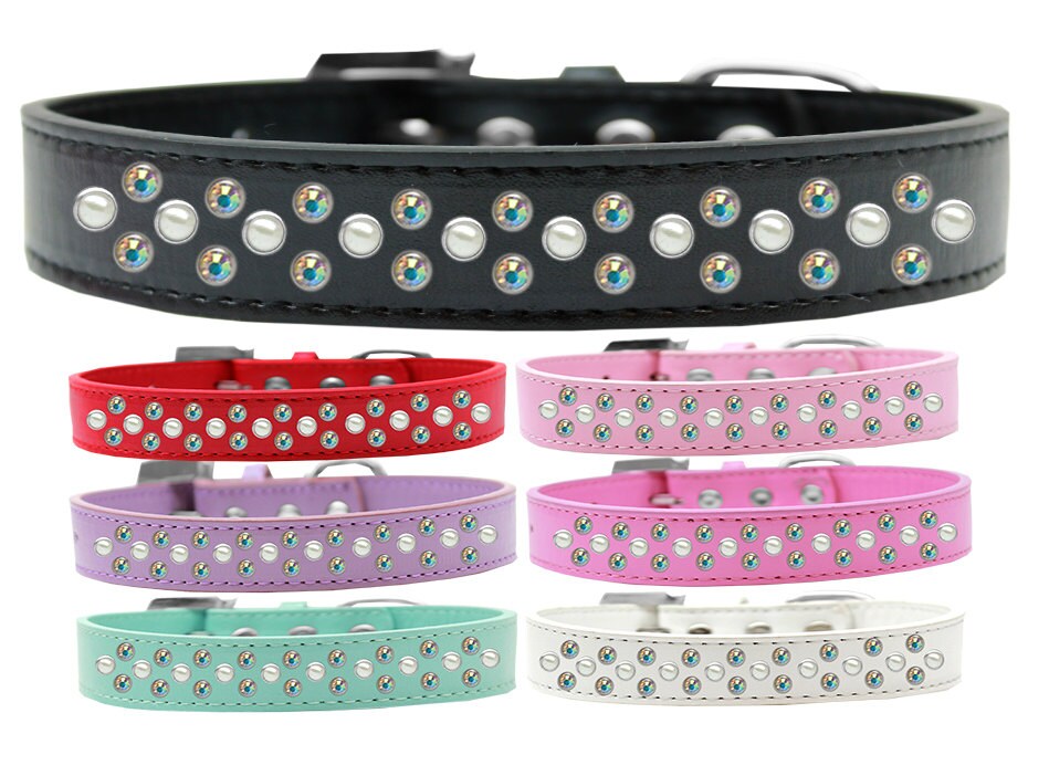 A stylish faux leather dog collar adorned with three rows of sparkling Pearl and Aurora Borealis crystals, showcasing elegance and comfort.
