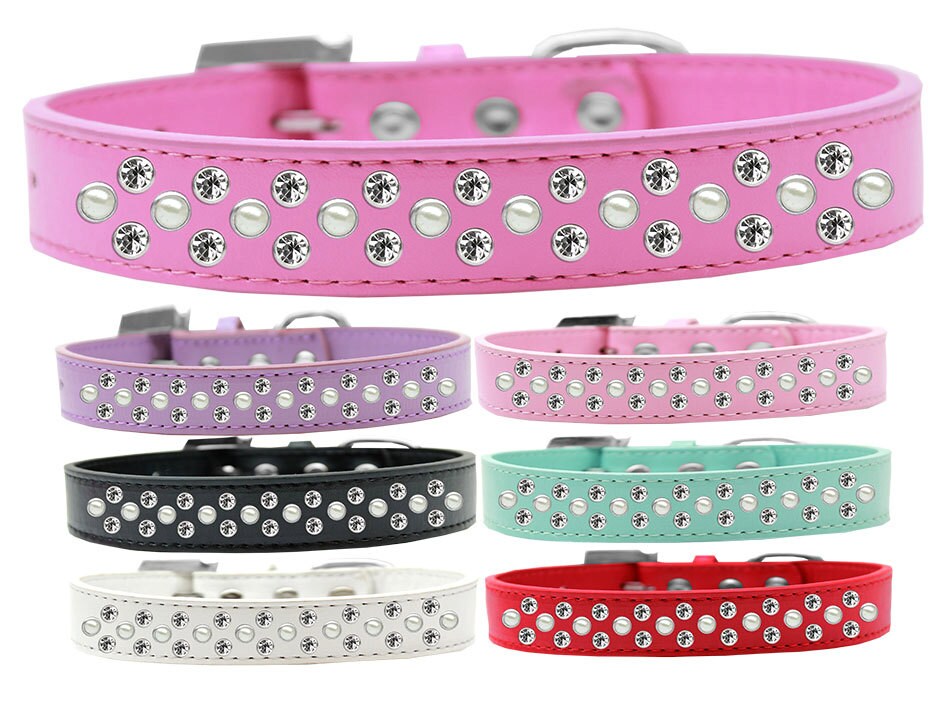 Elegant dog collar featuring pearl and clear crystal rimsets, designed for pets with a stylish faux leather finish.
