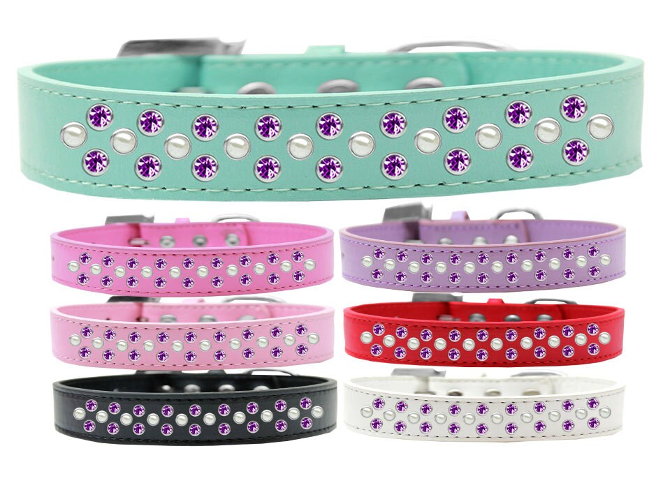 Stylish dog collar featuring pearl and purple crystal rimsets, made from faux leather with three rows of sparkling crystals.