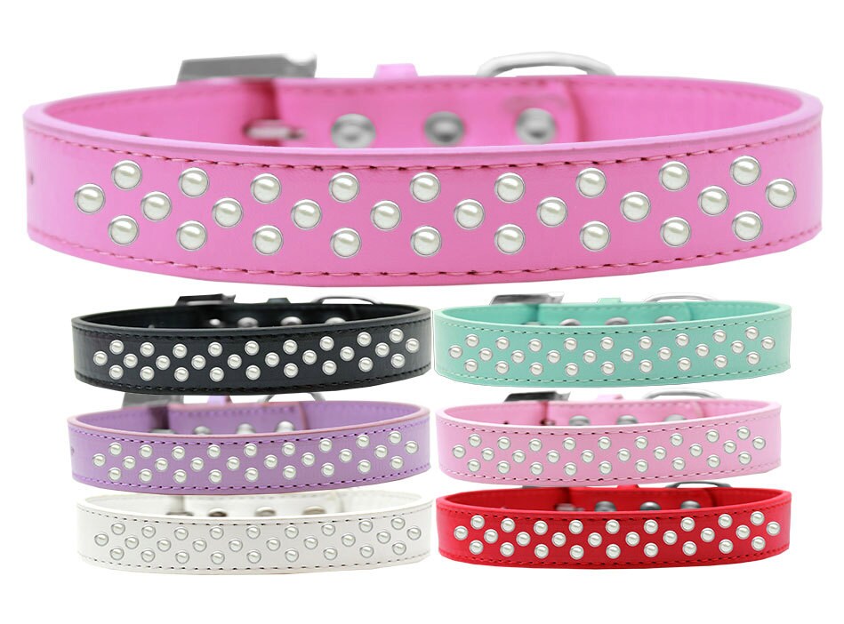 Elegant faux leather dog collar with three rows of pearl crystals, perfect for stylish pets.