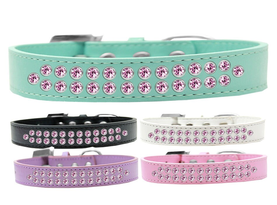 Light pink dog collar with two rows of crystal rimsets, featuring a crystal buckle and faux leather material.