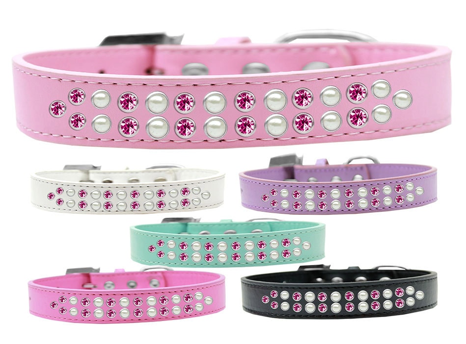 Stylish faux leather dog collar adorned with pearl and pink crystals, featuring a crystal buckle.