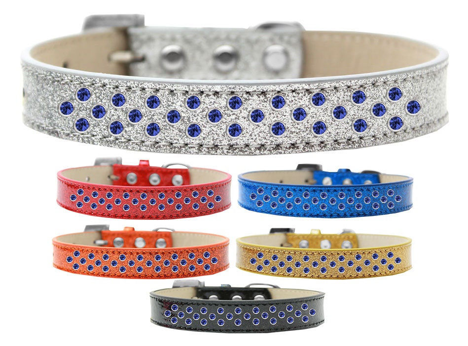A stylish dog collar featuring blue crystal rimsets and pearl sprinkles, designed for elegance and comfort.