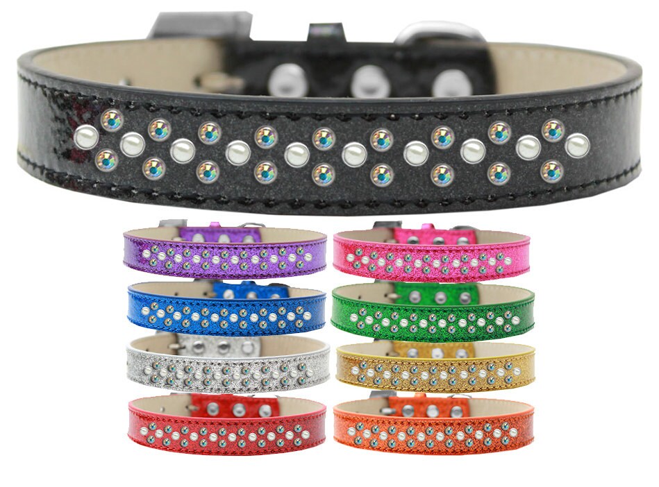 A stylish dog collar adorned with pearl and Aurora Borealis crystals, featuring three rows of sparkling stones on a soft glittery background.